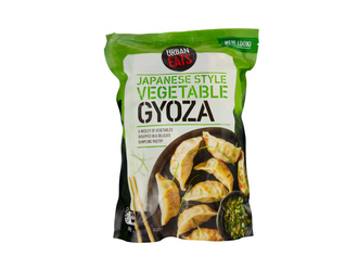 A green bag with gyoza on a black plate on the front labelled "Japanese Style Vegetable Gyoza"